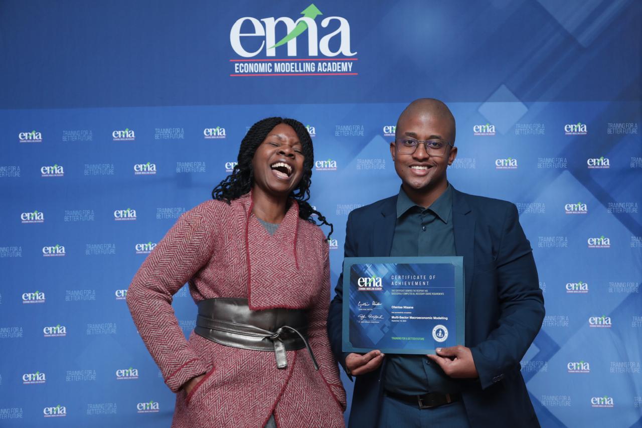 Ofentse Ntsane celebrating his EMA multi sector macroeconomic modelling certificate award